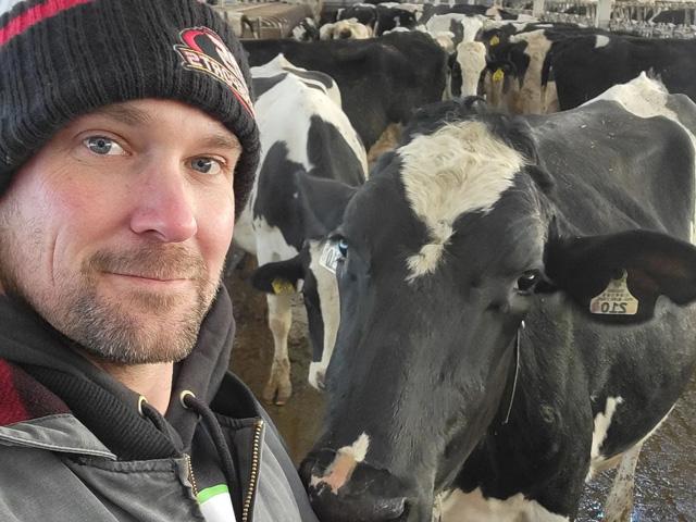 Zach Johnson, the Millennial Farmer, has had his world opened to other experiences through his social media contacts. Here he tours Pedley Holsteins in northern Iowa. (Photo courtesy of Zach Johnson)
