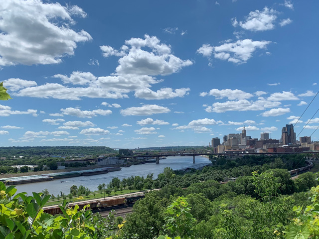 The Water Resources Development Act (WRDA) of 2020 includes a priority for barge industry, adjusting the cost share for lock and dam construction and major rehabilitation projects. Pictured is the Mississippi River in downtown St. Paul, Minnesota, running alongside a main railroad vein. The USACE St. Paul District operates and maintains 13 locks and dams beginning at Upper St. Anthony Falls in downtown Minneapolis and ending at Lock and Dam 10 in Guttenberg, Iowa. (Photo by Mary Kennedy)