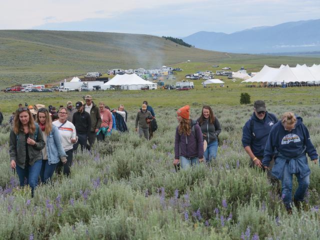 A group of about 80 people took an early hike Saturday at the Old Salt Festival on the Mannix Ranch in Montana outside of the small town of Helmville. The Old Salt Co-op is an LLC formed by four Montana ranches to direct market their beef to consumers. The ranchers created an inaugural three-day music festival this past weekend to promote their efforts. (DTN photo by Chris Clayton)