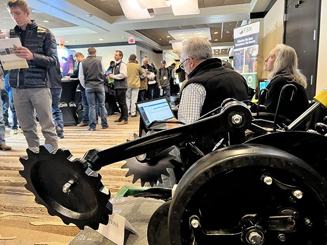 Participants visit the exhibit area for the No-till on the Plains conference this week in Wichita, Kansas. As part of the event, the group honored Ohio farmer David Brandt, a well-known speaker on no-till farming and cover crops. (DTN photo by Chris Clayton) 