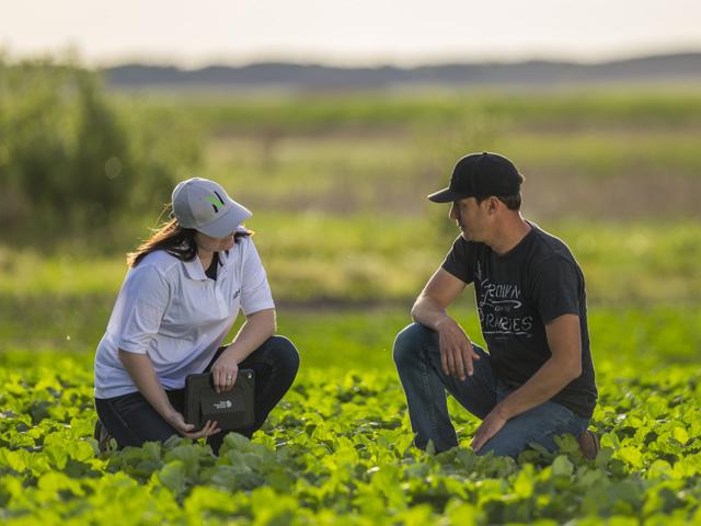 A Nutrien Financial representative works side-by-side with farmers, helping them develop confidence in their business plan and access capital for their operation. (Photo Courtesy of Nutrien Financial)