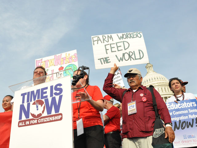 Farmworkers protest in 2013 during a rally calling on Congress to pass comprehensive immigration reform. The bill that passed the Senate had funding for 700 miles of a border barrier, but the bill never came up for a vote in the House. (DTN file photo)