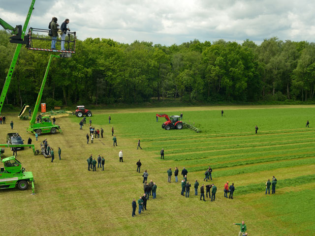 Journalists from 21 countries watched Krone hay and forage equipment go through the paces in a field in Winterswijk, The Netherlands, last week. (DTN/The Progressive Farmer photo by Jim Patrico)