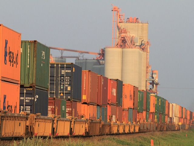 Containers loaded on rail cars heading for export. (DTN photo by Elaine Shein)