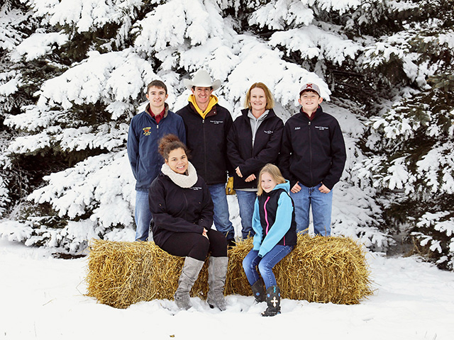 The Huber family&#039;s North Dakota cattle operation includes Isaac, Bryan, Emmy and Alex Huber (left to right, standing) and Taylor Solinger-Gaines and Betsy Huber (left to right, seated). (DTN/Progressive Farmer photo by Patty Wood Bartle)