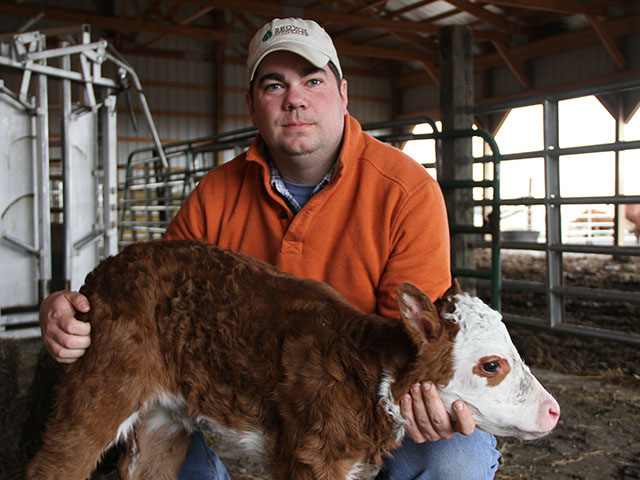 View From the Cab farmer Chase Brown holds one of the calves he is raising on his Decatur, Illinois farm. 