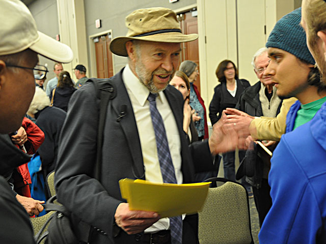 Scientist turned climate activist James Hansen meets with students and others at Creighton University after a speech Friday night. (Chris Clayton photo) 