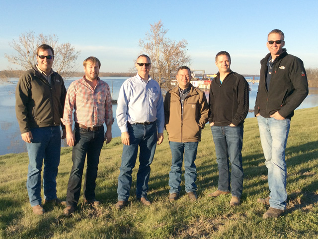 Jeremy Jack (left) and Andrew Miller (third from right) formed a peer group with TEPAP classmates after finishing the two-year course. They now meet twice a year on each other&#039;s farms to review goals and critique their businesses. In between visits, they stay in touch by regular emails. (DTN photo by Marcia Taylor)