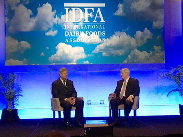 Tom Vilsack, president and CEO of the U.S. Dairy Export Council, sits with Michael Sykes, president and CEO of the International Dairy Foods Association at the group&#039;s forum Tuesday in Orlando. (DTN photo by Jerry Hagstrom) 