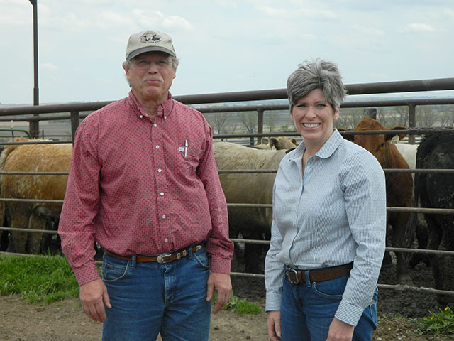 Iowa Sen. Joni Ernst (right) toured Gregory Feedlots outside of Tabor, Iowa, on Wednesday afternoon after hearing from area livestock producers such as David Trowbridge (left) who manages the feed yard. (DTN photo by Chris Clayton) 