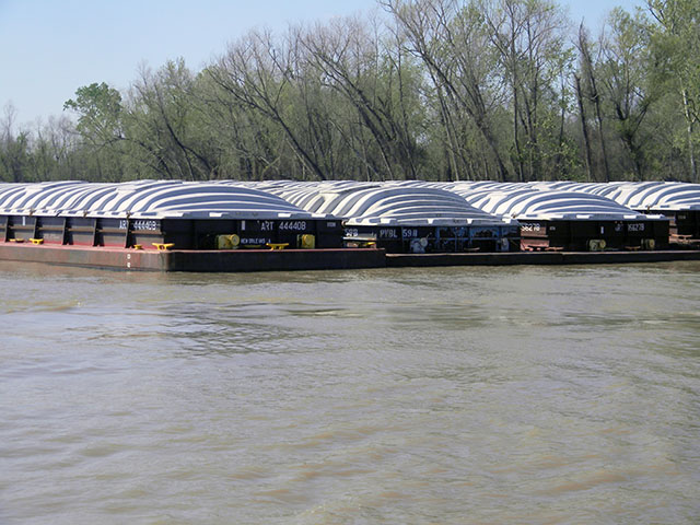 Because DDGS demand from Asian markets has weakened, the container market for export has been slow, but DDGS movement on barges destined for the Gulf has picked up pace. These barges are on the Mississippi River in Destrehan, Louisiana. (DTN photo by Mary Kennedy)