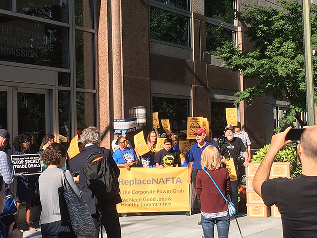 A couple dozen protesters demanding major labor-law changes to NAFTA stood outside a hearing Tuesday in Washington. (DTN photo by Chris Clayton) 