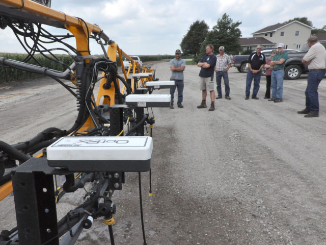 People look over optical sensing technology on a high-clearance sprayer at a University of Nebraska-Lincoln (UNL) Project Sensors for Efficient Nitrogen Use and Stewardship of the Environment (SENSE) field day near Schuyler, Nebraska, on Aug. 7. (DTN photo by Russ Quinn)