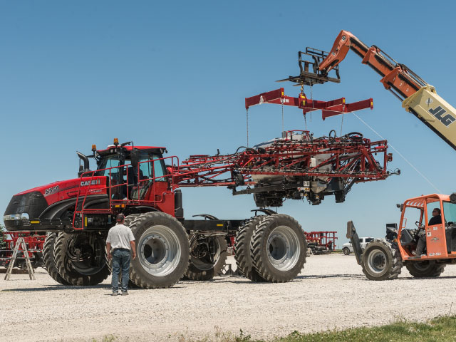 The Trident is a quick-change artist: It can go from dry material spread to sprayer in less than an hour. Here it becomes a sprayer. (Photo courtesy of Case IH)