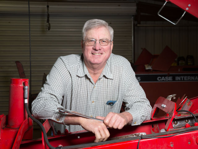 Under the hood, behind the baler, Steve Thompson has answers for readers' questions. (DTN/The Progressive Farmer photo by Larry Fleming)