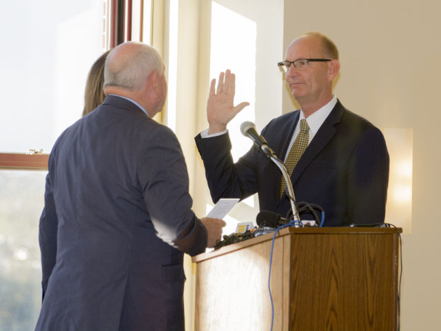 U.S. Secretary of Agriculture Sonny Perdue swears in Greg Ibach as undersecretary for marketing and regulatory programs on Monday in Omaha. (DTN photo by Nick Scalise)