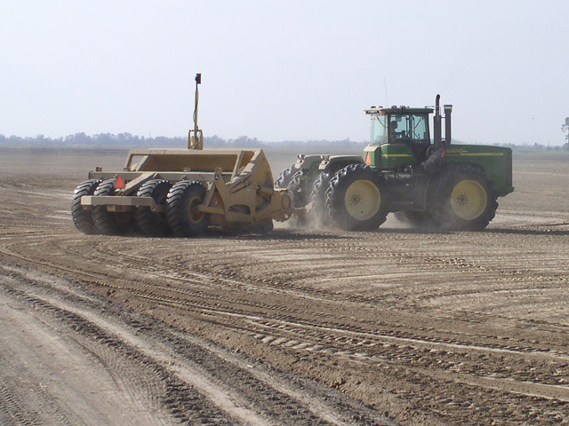 It may take the expertise of a land-leveler to smooth the swells and troughs that currently cover the market terrain of live cattle and lean hog futures. (Photo courtesy of USDA NRCS)