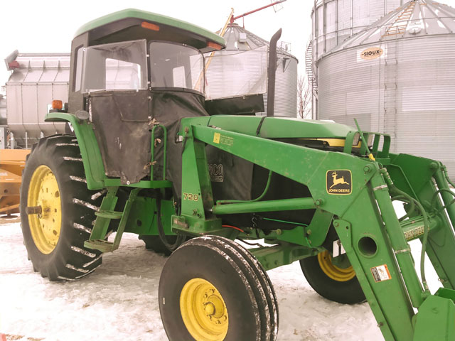 Farmer Lyn Wessel of southern Minnesota utilizes a slightly altered heat houser on his 1998 John Deere 7405 open station tractor. He pushes snow with this tractor with the help a loader and blower as well as "$400 of Carhart and UnderArmour products and I&#039;m good to -20 F." (Photo courtesy of Lyn Wessel)