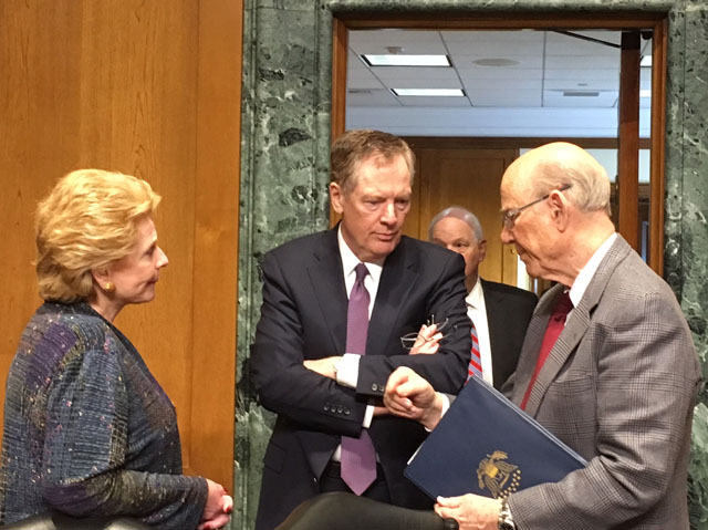 Senators Debbie Stabenow (left) and Pat Roberts (right) talk with U.S. Trade Ambassador Robert Lighthizer (center) before a hearing with the Senate Finance Committee on Thursday. (DTN photo by Chris Clayton)