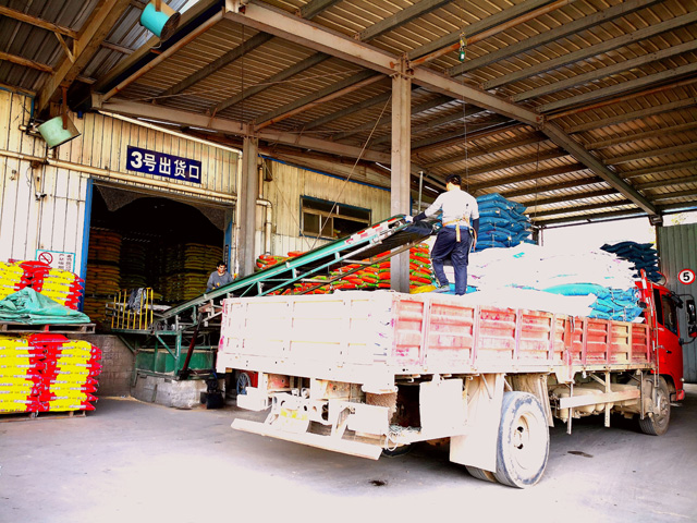 A worker loads swine feed at Haid, one of China&#039;s largest feed companies, last week in the Hubei Province in China. Officials in China excluded soybeans from a long list of commodities that will now face tariffs. (DTN photo by Lin Tan) 