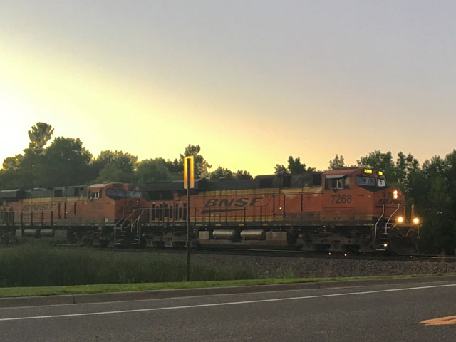 BNSF train moving east along the Northern Transcon at dusk. (Photo by Kelly Moshier, Maple Grove Minnesota)