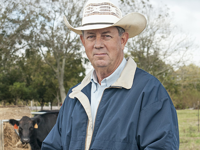 Malcomb Pegues uses CattleMax on his smartphone to track cows or cleanup bulls while in the field. (DTN/Progressive Farmer photo by Becky Mills)