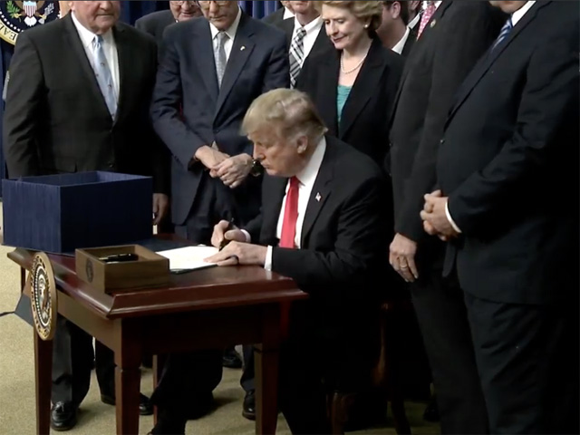 President Donald Trump signs the farm bill at a ceremony Thursday afternoon at the White House. Trump praised farmers and the bipartisan group of lawmakers who worked on the legislation. (Image from C-SPAN broadcast)