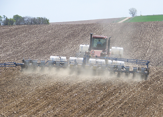 The dust stirred up at corn planting time often contains neonicotinoid insecticides from seed treatments, and the industry is slowly responding to the problem. (DTN photo by Bryce Anderson)
