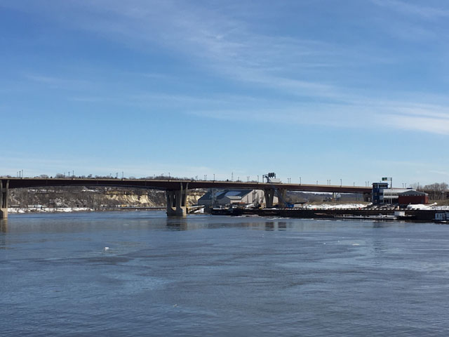 The only action on the Mississippi River in downtown St. Paul on March 16 was a few floating ice chunks, as barges have yet to make their way past ice-filled Lake Pepin to officially start the 2019 shipping season. (DTN photo by Mary Kennedy)