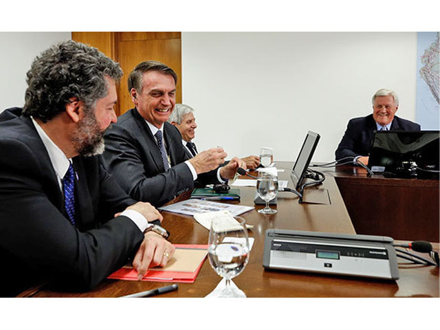 House Agriculture Committee Chairman Collin Peterson, D-Minn., right, meets with President Jair Bolsonaro of Brazil, second from left, on Friday. (Photo courtesy of the Office of Rep. Peterson)