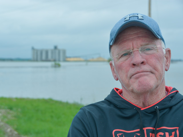 Richard Oswald stands near his still-flooded farm by Rockport, Missouri. Fields and roads in his area, which is in the Missouri River Valley, have been flooded since mid-March. (DTN photo by Chris Clayton) 