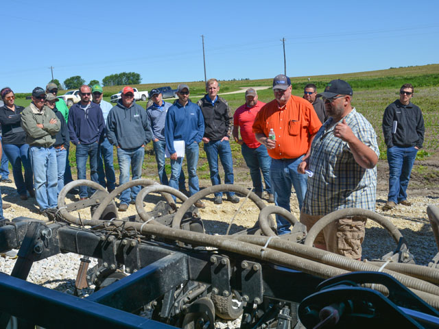 Loran Steinlage explains how his cover crop interseeder works during a field day June 13 at his farm near West Union, Iowa. (DTN/Progressive Farmer photo by Matthew Wilde)