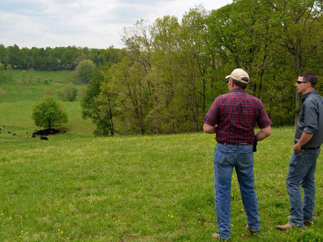 Kentucky cattle producer, Bob Hornsby (left), is working with David Coffey, agriculture and natural resources Extension agent, to downsize his herd and improve grazing. (Photo by Katie Pratt, UK ag communications)