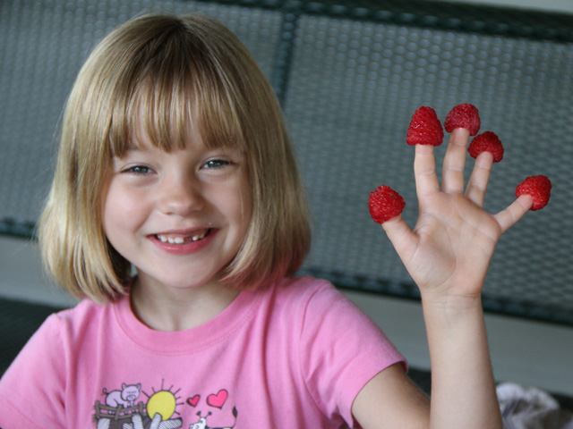 Give Julia Smith a high five. How many raspberries can you eat is a popular game at our house, but the taste is even sweeter if they are locally grown. (DTN photo by Pamela Smith)