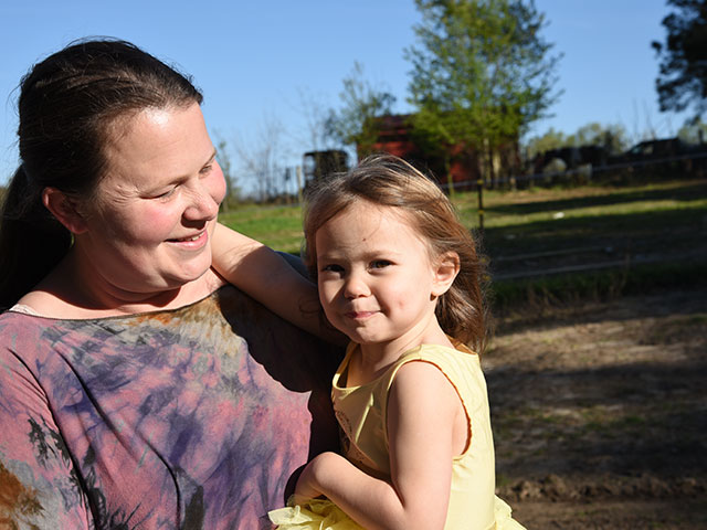 Beth Hornsby and daughter Stella often share life on the farm with their digital Facebook family. (DTN/Progressive Farmer photo by Becky Mills)