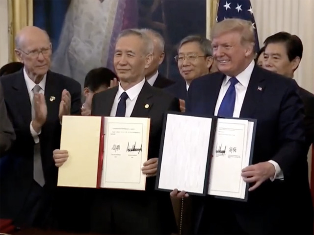 With Sen. Pat Roberts, R-Kan., looking on from the left, President Donald Trump signed the phase-one trade agreement on Wednesday with China&#039;s Vice Premier Liu He. The president&#039;s trade team said China will buy $40 billion in agricultural products from the U.S. each of the next two years. (Photo shot from White House live feed) 