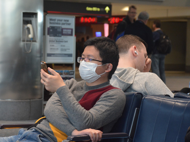 Facemasks are becoming a more common sight, especially in places with significant travel, such as airports, in response to the COVID-19 virus. On Tuesday, Ag Secretary Sonny Perdue talked about what USDA is doing for food aid, especially school lunches, in response to potential increases in school closures nationally. (DTN photo by Matthew Wilde)