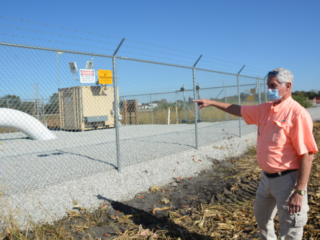 Keith Puntenney points to a valve station for the Dakota Access Pipeline built on a neighbor&#039;s farm. In pushing back against a proposed carbon pipeline that could cross his land, Puntenney points to multiple years of yield losses as well as the risks that tiling on the farm would be damaged. (DTN photo by Chris Clayton)