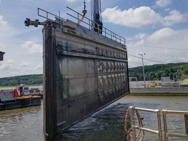 The Illinois Waterway consolidated lock closures began on July 1, 2020, closing a portion of the Illinois River for at least three months. While the closures were planned in advance, this is a good example of how delays happen, and in this case, shippers will need to look for other more expensive modes of transportation until the river reopens. On July 2, the first miter gates were pulled at Starved Rock Lock and Dam in Ottawa, Illinois, to be repaired. Both the upper and lower miter gates will be replaced at Starved Rock during the closure. (Photo USACE Rock Island District)