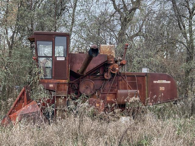 An International Harvester 303 combine sits in a grove of trees near Scribner, Nebraska. The combine was manufactured during the 1960s. (DTN photo by Russ Quinn)