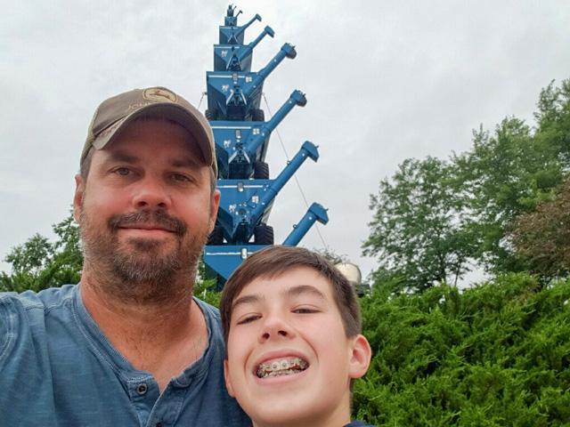 Looking for fun and education, Ryan Heiniger and son, Matthew, take a selfie to memorialize their trip to Kinze Manufacturing in Williamsburg, Iowa, this summer. (Photo courtesy of Ryan Heiniger)