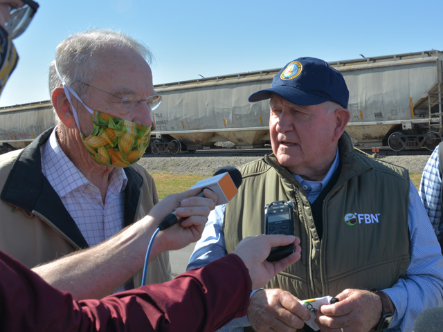 Sen Chuck Grassley of Iowa and Agriculture Secretary Sonny Perdue talk to reporters Thursday at the Golden Grain Energy ethanol plant outside Mason City, Iowa. USDA announced grants for blender pumps and other infrastructure to sell higher blends of ethanol. (DTN photo by Chris Clayton)
