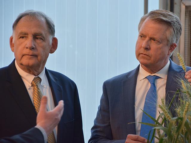 Sen. John Boozman, R-Ark., and Sen. Roger Marshall, R-Kansas, touring a wheat research facility earlier this spring in Manhattan, Kansas. Marshall is the lead sponsor of a bill that would stop states from dictating farm production practices to producers outside their states in response to the U.S. Supreme Court upholding California&#039;s Proposition 12. (DTN photo by Chris Clayton)