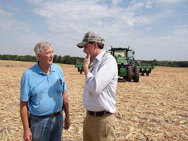 Robert Bonnie, USDA undersecretary for farm production and conservation, right, talks with Neal Bredehoeft of Alma, Missouri, after helping to plant a cereal rye cover crop on a recently harvested harvest corn field. Bonnie&#039;s visit to Bredehoeft&#039;s farm was part of an effort to highlight projects funded through the USDA&#039;s Climate-Smart Commodities pilot program. (DTN photo by Jason Jenkins)