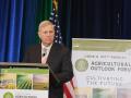 Agriculture Secretary Tom Vilsack speaking at the USDA Agricultural Outlook Forum on Thursday. His speech was initially interrupted by a critic of factory farmers. Still, the audience was more receptive than House Republicans at a congressional hearing a day earlier. (DTN photo by Katie Dehlinger) 