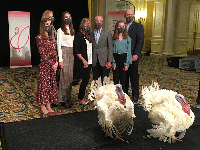 National Turkey Federation President Ron Kardel, an Iowa producer, is surrounded by his family at a news conference at the Willard Intercontinental Hotel in Washington, D.C., on Monday to introduce the turkeys he raised. (The Hagstrom Report photo by Jerry Hagstrom)