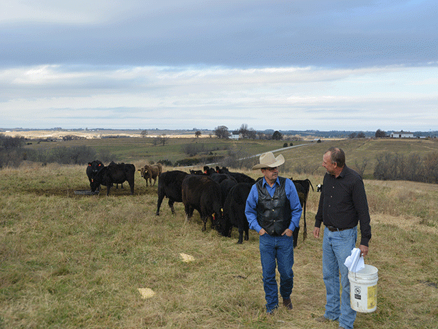 Farm Service Agency Administrator Zach Ducheneaux (left) talks with Seth Watkins, a cattle producer near Clarinda, Iowa. Hearing from producers, Ducheneaux said changes may be needed to adapt the Conservation Reserve Program so younger producers can integrate livestock on that ground without penalties. (DTN photo by Chris Clayton) 
