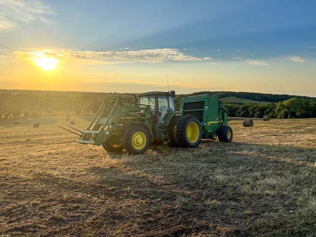 It&#039;s baling season and Zachary Grossman never tires of this view of the sun setting over the hayfields of northwestern Missouri. (Photo courtesy of Zachary Grossman)